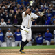 Yangervis Solarte celebrates after drawing the fateful walk. Via Getty Images.